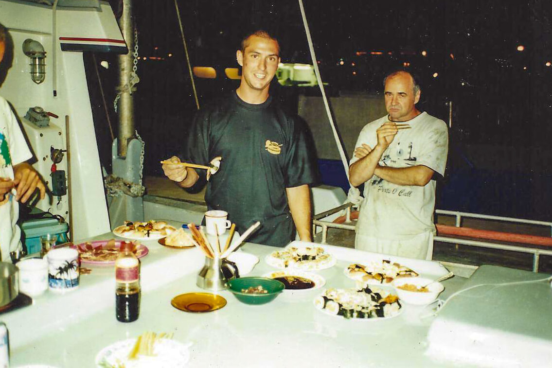 Chris Marks - practicing sushi skills boat worker