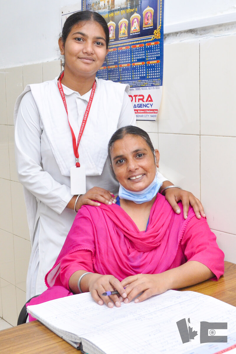dental assistant with daughter attending non-profit school in Punjab India