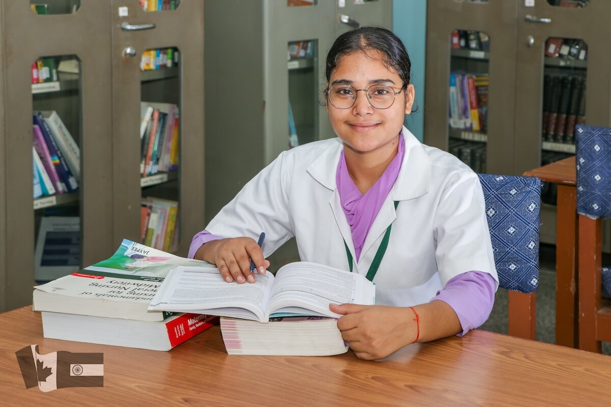Savitri - GNM nursing bursary recipient studying in library at Guru Nanak College of Nursing in Punjab