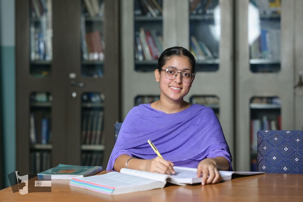 Harjot Kaur - nursing student studying in library - bursary recipient